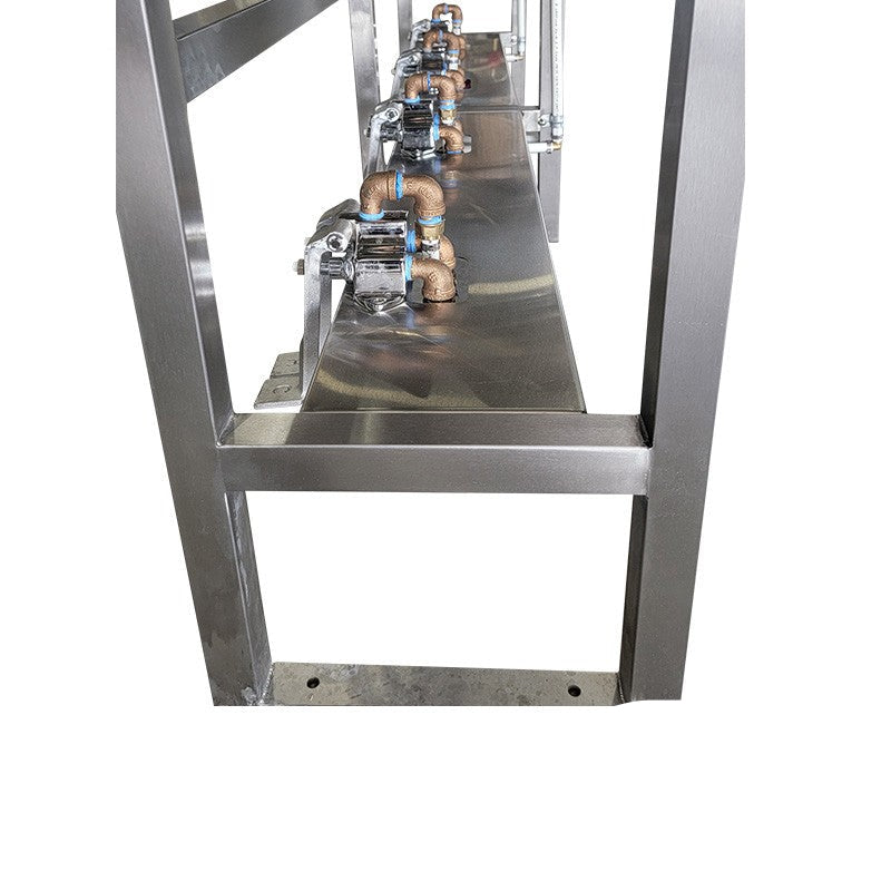 Close-up of hot, cold, and mixed water foot pedals on 4-user stainless sink station.