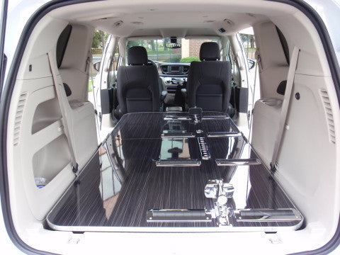 Traditional black funeral car used for transporting caskets