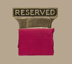 Polished gold "Reserved" sign for funeral home pews.