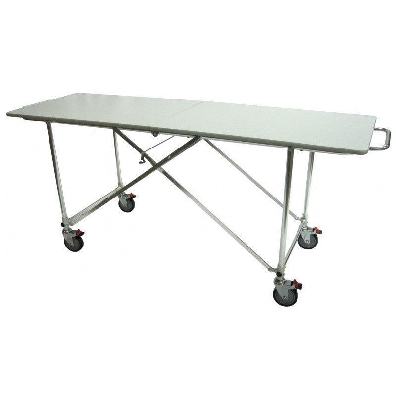View of a raised hydraulic embalming table, demonstrating its height adjustment and practical design.
